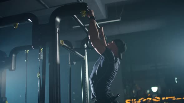 Slow Motion Disabled Man Athlete in Wheelchair Performs Pullups on the Horizontal Bar Gym Training