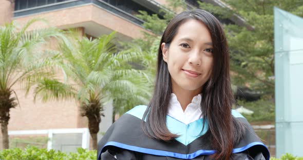 Woman wearing graduation gown