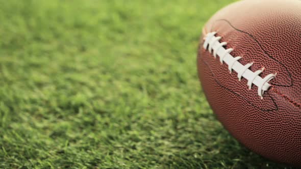 American Football Close up on on green grass.