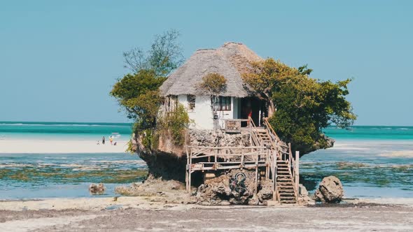 The Rock Restaurant in Ocean Built on a Cliff at Low Tide on Zanzibar Island