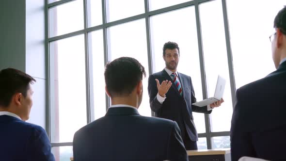 Group of Business People Meeting in a Seminar Conference