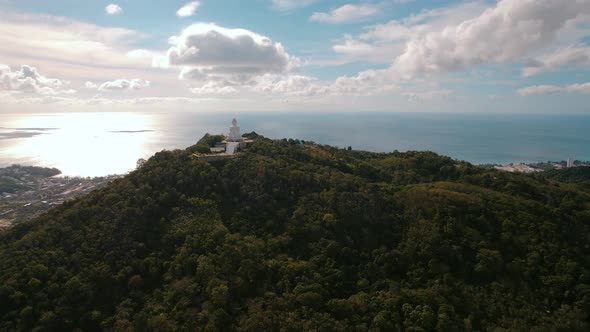 Aerial View of White Big Buddha Statue Temple on Hilltop Overall Drone Shot