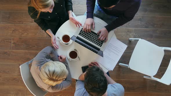 Group of Business People Working at the Desk and Leaving