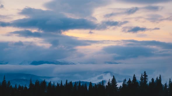 Flowing Clouds Time Lapse in Winter Mountain at Sunset