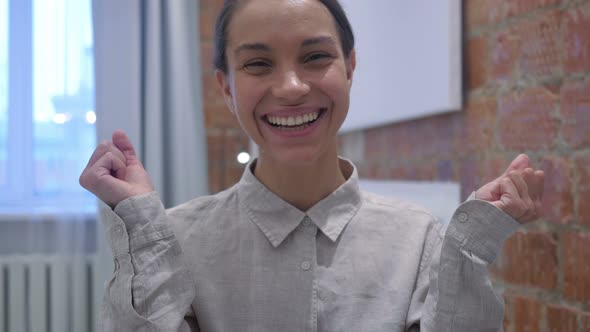 Hispanic Woman Celebrating Success