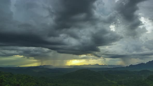 Rain storms and black clouds moving over the mountain.