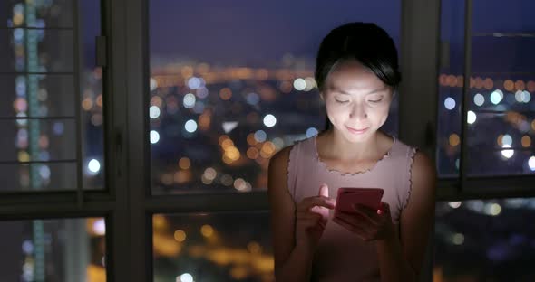 Woman Use of Smart Phone in The Evening at Home 