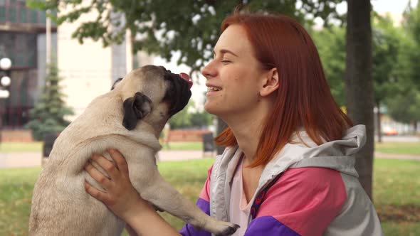 Girl Kissing Her Pug