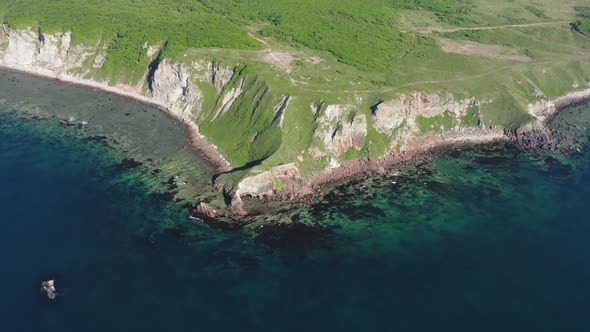 Drone View of a Natural Stone Arch By the Sea