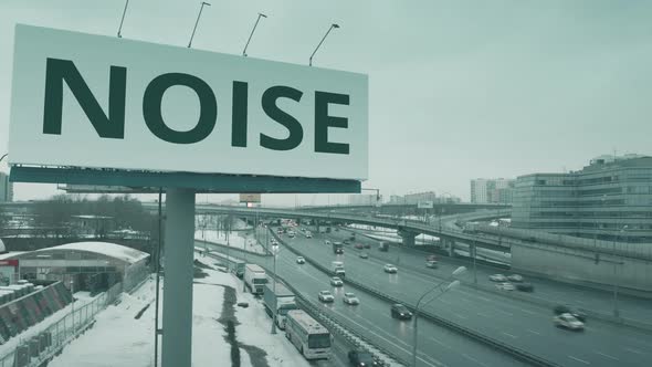 Billboard with NOISE Text at Urban Highway in Winter