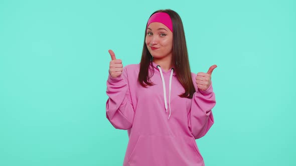 Teen Stylish Girl in Pink Hoodie Showing Thumbs Up and Nodding in Approval Successful Good Work