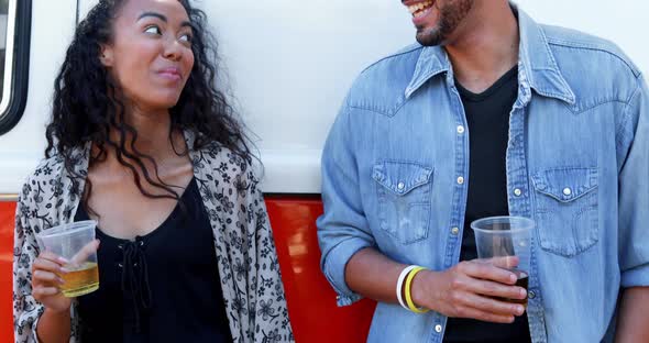 Couple interacting with each other while having glass of beer 4k