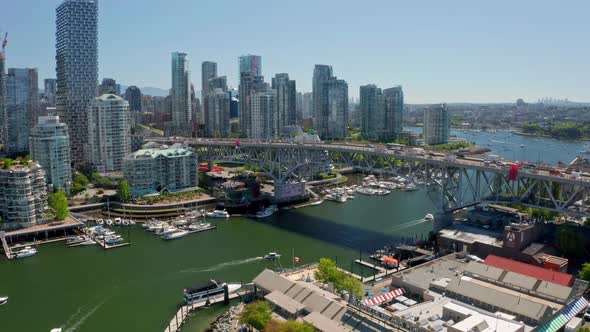 Traffic At Granville Bridge Over False Creek With Downtown Vancouver Skyline In Canada. - aerial des