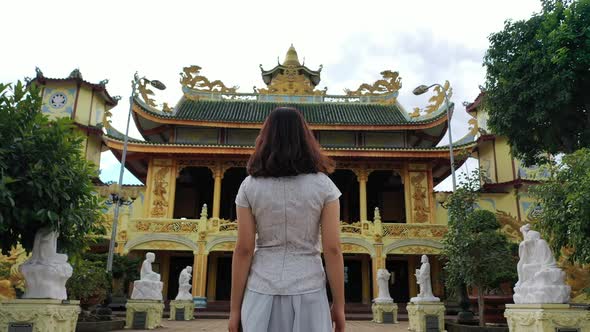 Asian Woman goes to the Temple