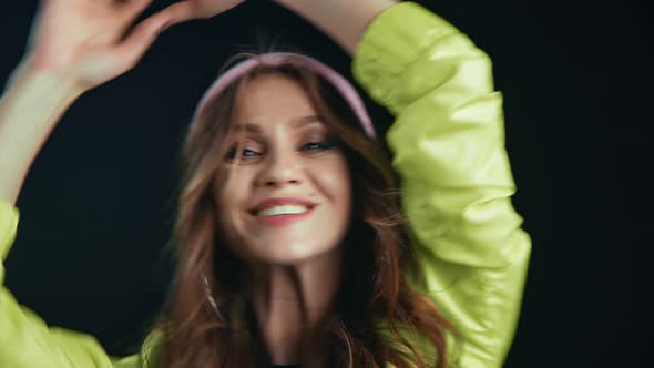 Closeup Face of Adorable Young Woman Dancer Having Fun at Party