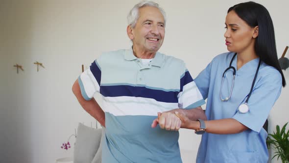 Animation of biracial female doctor and caucasian senior man during recovery