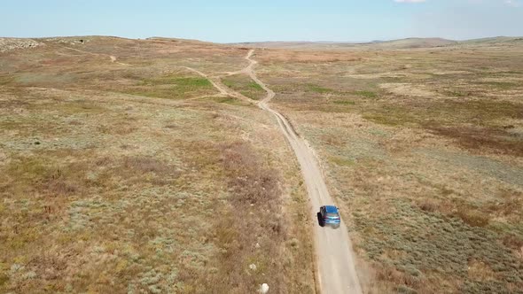 Aerial view. Cars go across the field. General's beaches, Crimea