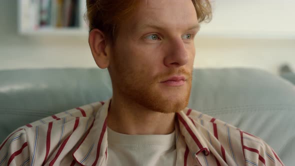 Serene Guy Relaxing Home in Pajamas Closeup