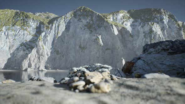 Sand Beach Among Rocks at Atlantic Ocean Coast in Portugal