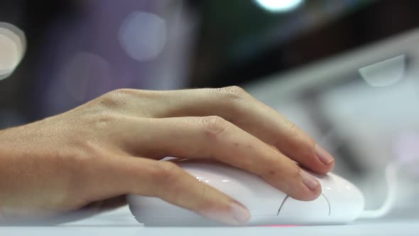 Woman Using A White Computer Mouse