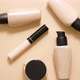 Bottles of Makeup Foundation and Samples on Beige Background - VideoHive Item for Sale