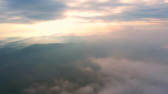 4K Aerial view of Mountains landscape with morning fog.