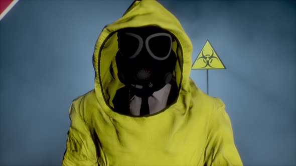 Man in a Yellow Hazmat Suit Makes a Stop Hand Gesture