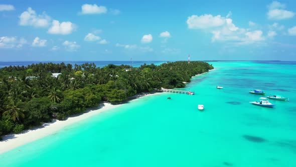 Aerial drone shot panorama of paradise island beach journey by blue ocean and white sandy background