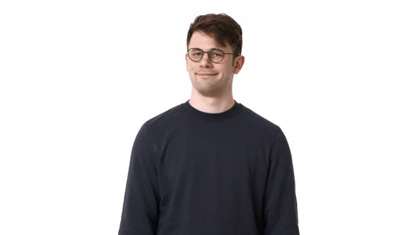 Portrait of Caucasian Guy Wearing Black Sweatshirt and Eyeglasses Shaking Head in Rejection Meaning