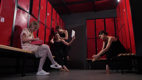 Girls Dancers Preparing for Lessons in Locker Room