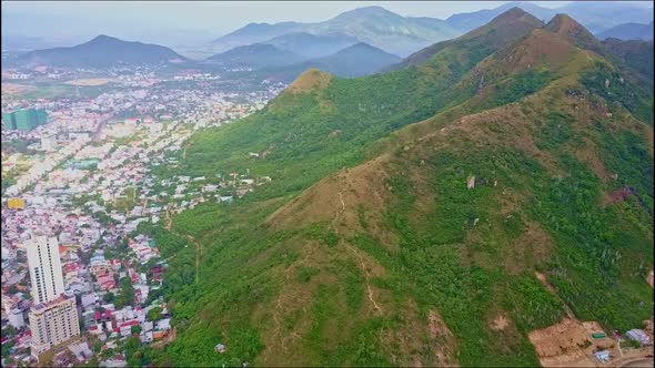 Aerial View Huge Mountain Ridge and Big Modern City