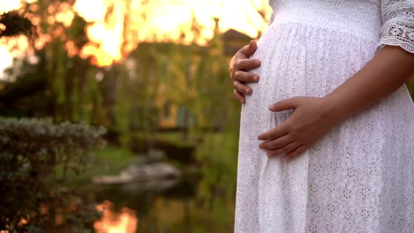 Pregnant Woman Feeling Happy at Garden Home