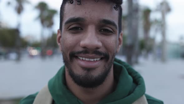 Smiling Young Hispanic American Young Man Standing Outdoors