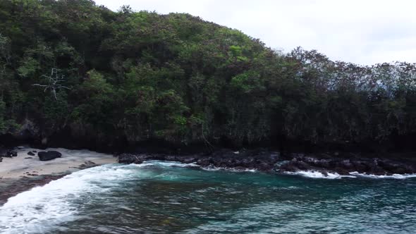 Fly along peninsula with blue water