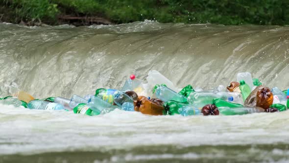 Plastic bottles and garbage in river water