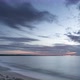 Stratus Layered Clouds Moving on a Sky on Sunset over Baltic Sea in a Bay near Gdansk, Poland - VideoHive Item for Sale
