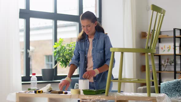 Woman Stirring Paint for Chair Restoration