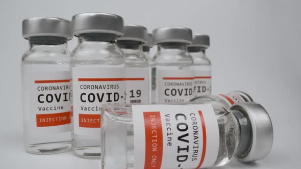 Glass Vials of the Covid19 Vaccine Against White Background