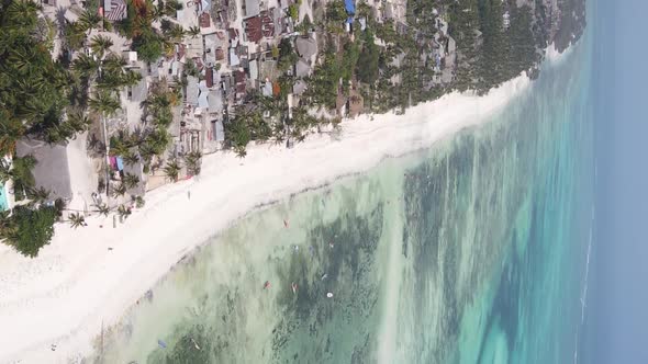 Vertical Video Boats in the Ocean Near the Coast of Zanzibar Tanzania Aerial View