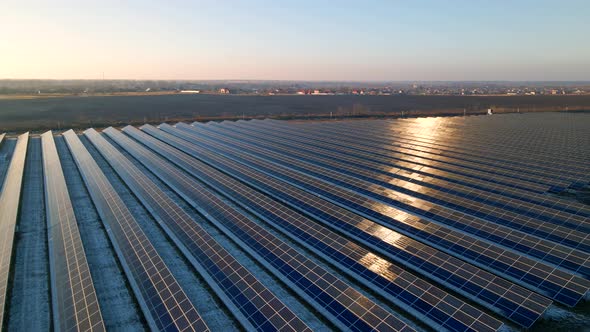 Aerial View of Solar Panels Stand in a Row in the Fields Power Ecology Innovation Nature Environment