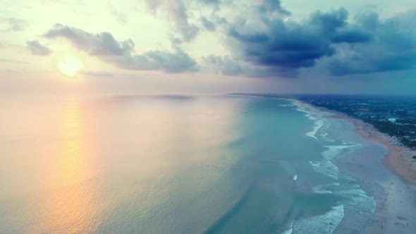 Aerial Flight Over The Ocean At Sunset