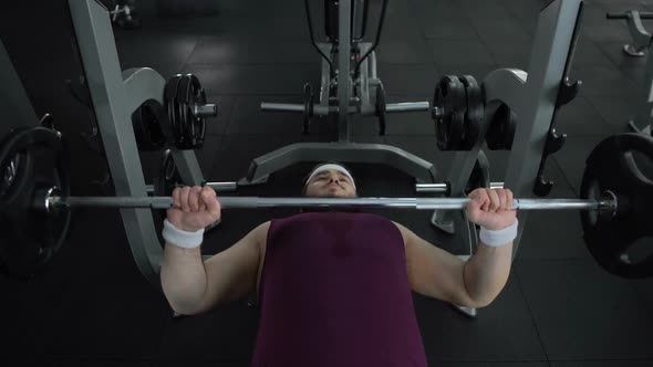 Chubby Man Unable to Lift Heavy Barbell in Gym During Sport Exercise, Health