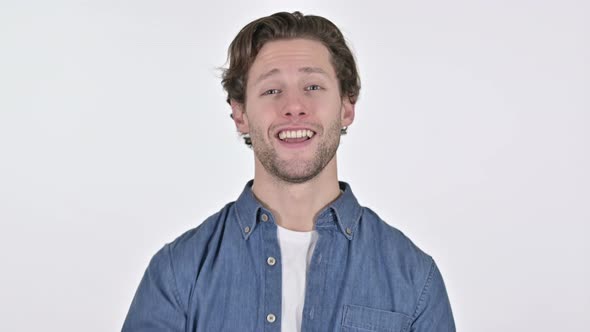 Attractive Young Man Waving and Welcoming on White Background