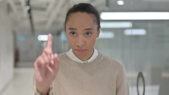 African Woman Pointing at the Camera