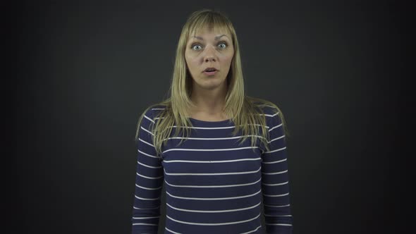 Woman in Black Striped Pullover Performs Shock Emotions