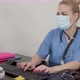 Medical Practitioner in Mask Using Computer - VideoHive Item for Sale