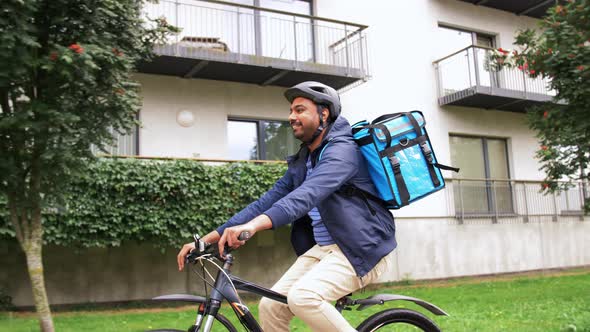 Indian Delivery Man with Bag Riding Bicycle