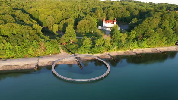 Drone Scenic Shot of Infinite Bridge in Denmark with Trees in Background