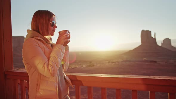 Beautiful Woman at Hotel Balcony with Great Nature Landscape Drinks Hot Coffee