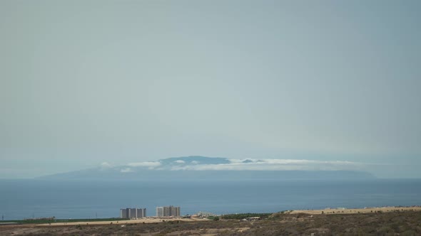 La Gomera island with clouds rolling over from Tenerife island time lapse view